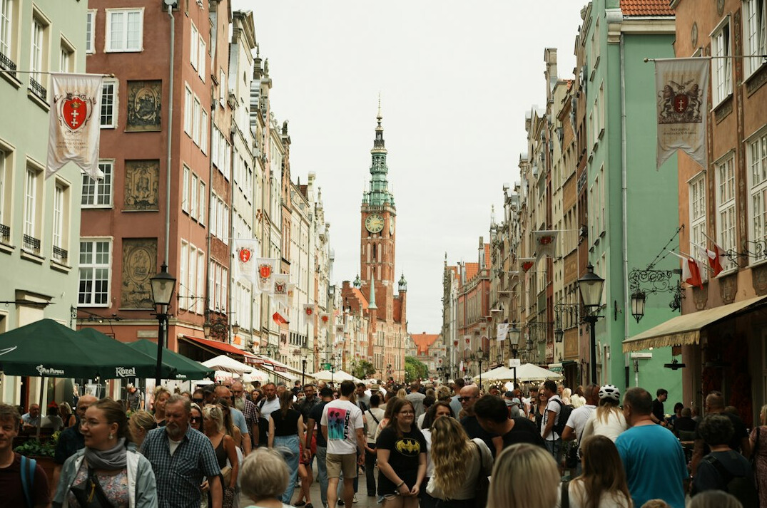 Small town market street in Poland with people and stalls