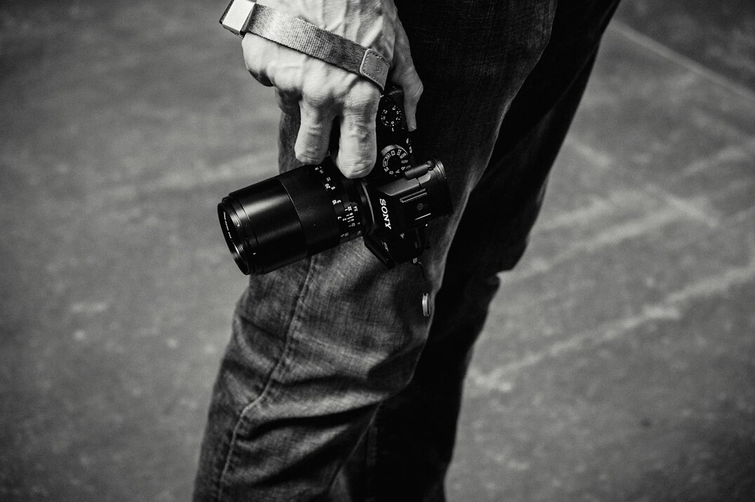 Portrait of a documentary photographer holding a camera