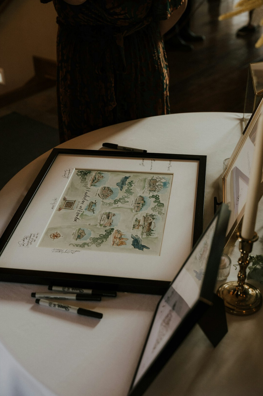 Editorial team reviewing photo prints on a table