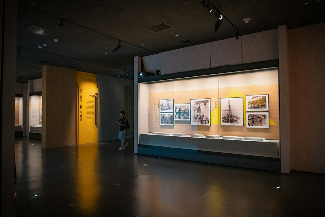 Framed documentary photographs displayed in a gallery exhibition