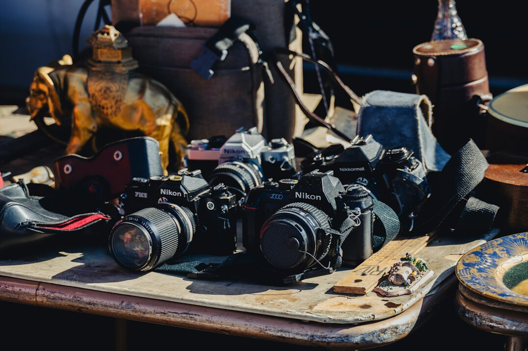 Camera equipment laid out on a table before a shoot
